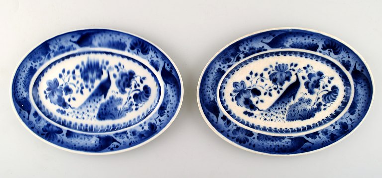 Peacock from Copenhagen faience / Aluminia.Large oval platter in earthenware. 2 pcs. in stock.