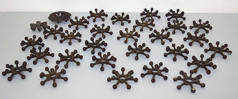 Jens H. Quistgaard, collection of candlesticks in cast iron.A total of 30 candlesticks.