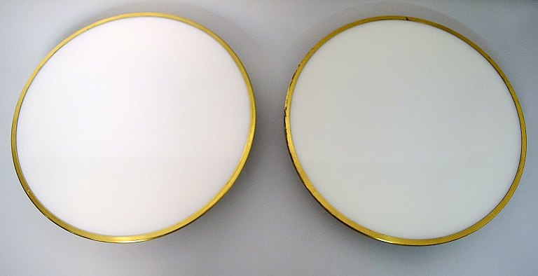 Arne Jacobsen. 1902-1971. Two ceiling / wall lamps.Model Munkegaard of white opal glass.