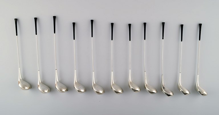 11 Danish design drink coolers. Shaped like golf clubs. Nickel silver.