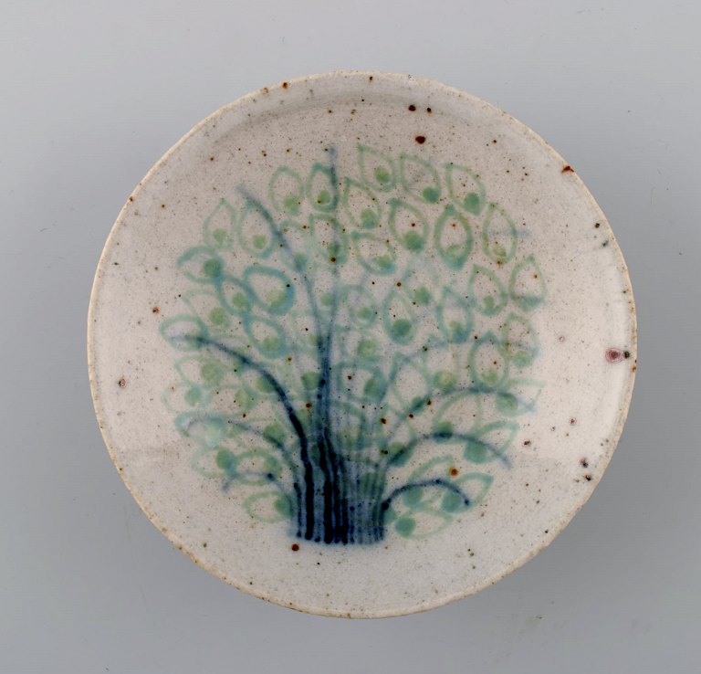 Snorre Stephensen for Royal Copenhagen: Small stoneware bowl decorated with tree in blue and green glaze, overlaid with transparent glaze.