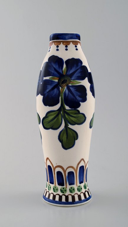 Aluminia faience vase, hand-painted with floral motifs.