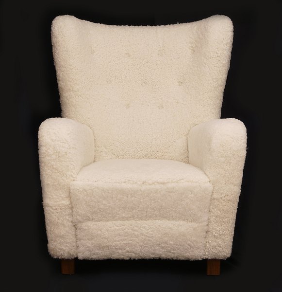 Easy chair produced by unknown Danish Manufacturer. Upholstered with sheepskin. 
Denmark circa 1935. H: 105cm. W: 81cm