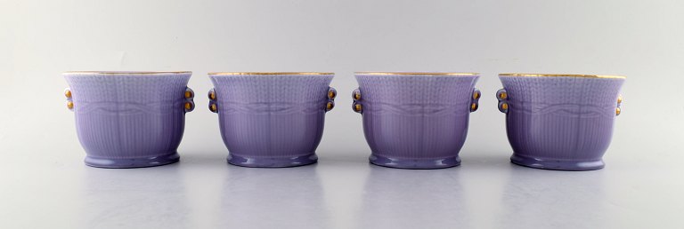 Louise Adelborg (b.1885, 1971) for Rörstrand / Rørstrand, Sweden. Set of four Swedish Grace flower pots in purple with gold decoration. 1930 / 40s