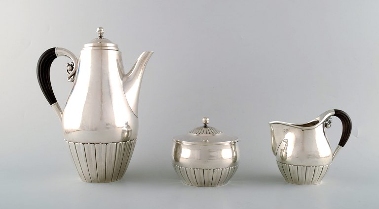 Johan Rohde for Georg Jensen. "Kosmos" coffee set in sterling silver with ebony handles. Dessin 45A and 45D.