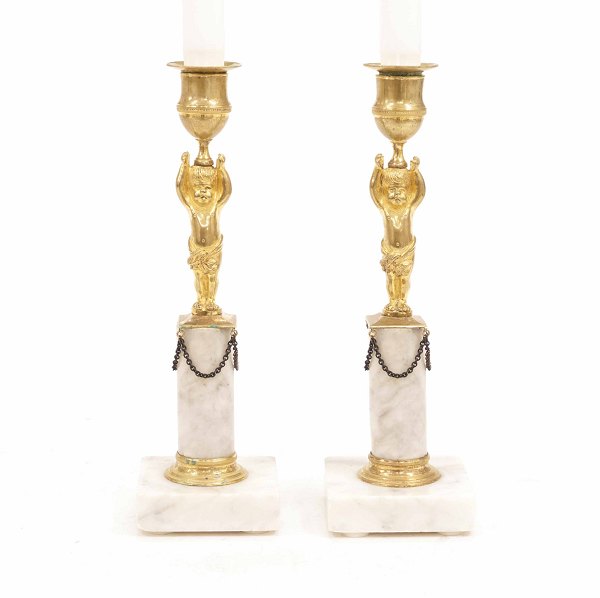 A pair og gilt early 19th century bronce candlesticks. France circa 1810. H: 25cm