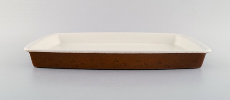 Stig Lindberg for Gustavsberg. Large "Coq" ovenproof tray in glazed stoneware. Rustic design, 1960