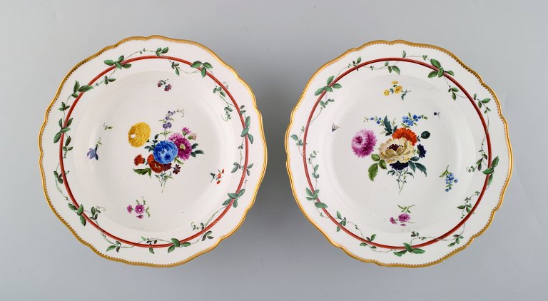 Two antique Meissen deep plates in pierced porcelain with hand-painted floral motifs. Museum Quality. Dated 1773-1814.