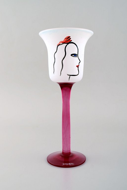 Ulrica Hydman Vallien for Kosta Boda. Hand painted wine glass in mouth blown art glass decorated with woman