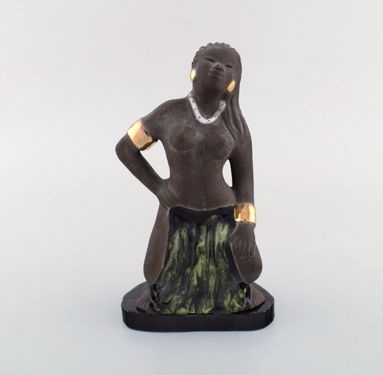 Bengt Wall, Sweden. Balinese girl in raw and glazed ceramics with gold decoration. 1950