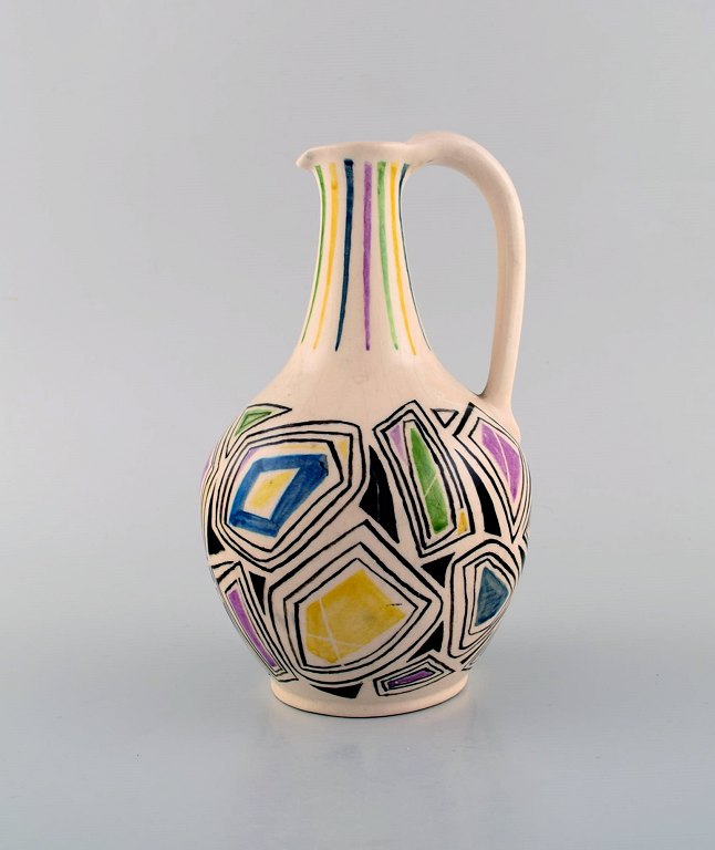 European studio ceramist. Unique jug with handle in glazed ceramic. Dated 1957.