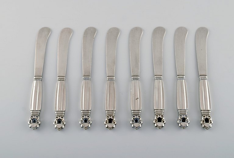 Eight Georg Jensen Acorn butter knives in all sterling silver.