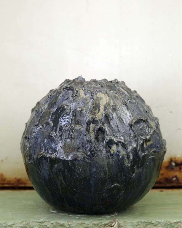 Christina Muff, Danish contemporary ceramicist (b. 1971). Hand modeled stoneware vase from the ‘Seed’ series. The vase is decorated with clay and has a beautiful, dark blue glaze with splashes of yellow.