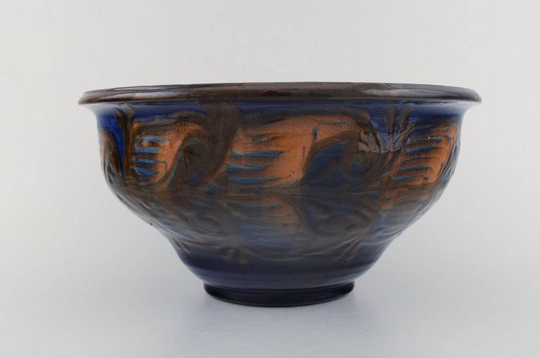 Kähler, Denmark. Bowl in glazed stoneware. Orange foliage on blue background. 1930 / 40s.