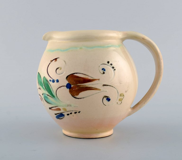 Kähler, HAK. Jug in glazed stoneware. Flowers on a cream colored background. 1930 / 40s.