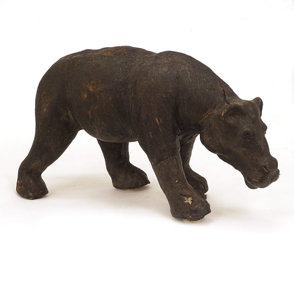 A large leather hippopotamus. In the manner of Dimitri Omersa. H: 35cm. L: 65cm. W: 22cm