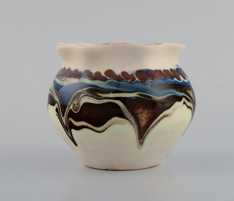 Kähler, Denmark. Glazed stoneware vase in modern design. Blue and brown running glaze on a cream background. 1930s / 40s.