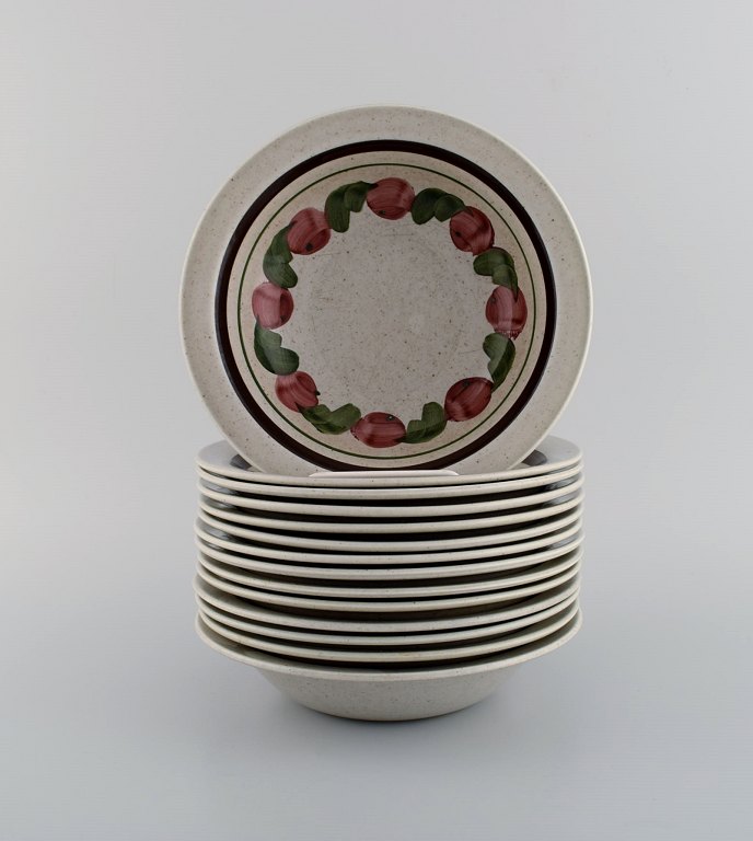 Jackie Lynd for Rörstrand. 14 Birgitta deep plates in hand-painted glazed stoneware. 1970s.