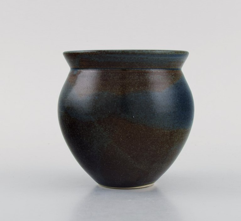 European studio ceramicist. Unique vase in glazed stoneware. Beautiful glaze in blue and brown shades. Late 20th century.