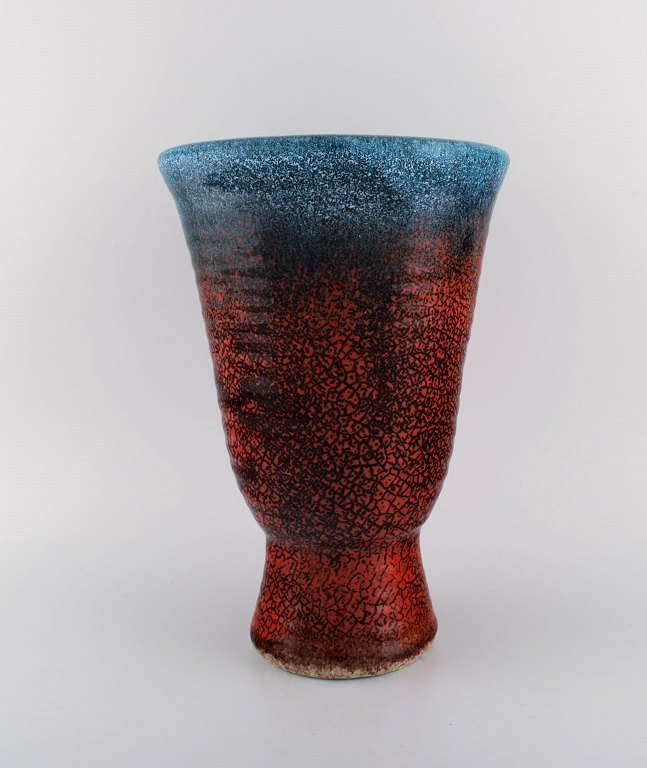 Accolay, France. Large art deco vase in glazed ceramics. Beautiful glaze in red and blue shades. 1940s.