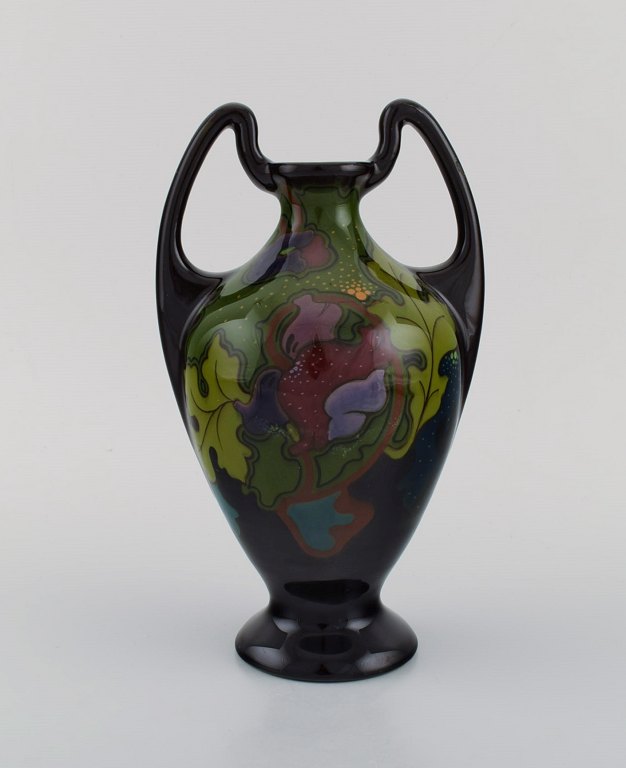 Regina, Holland. Antique art nouveau vase in glazed ceramics with hand-painted flowers and foliage. Approx. 1910.
