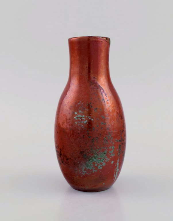 European studio ceramicist. Unique vase in glazed stoneware. Beautiful metallic glaze in shades of red. Mid-20th century.