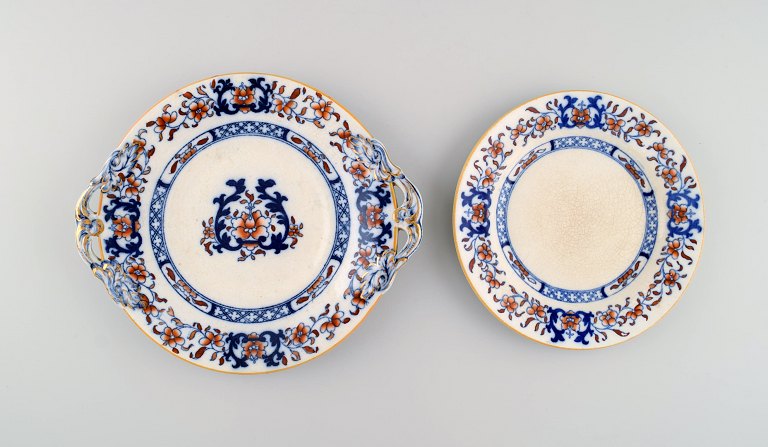 Mintons, England. Two antique plates in hand-painted faience. Chinese style, early 20th century.
