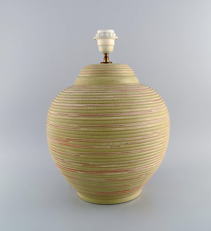 European studio ceramicist. Large table lamp in glazed stoneware with grooved body. Beautiful crackle glaze. 1970s.