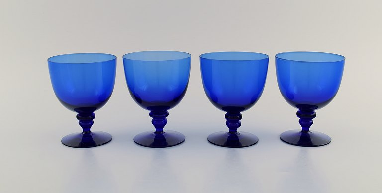 Monica Bratt for Reijmyre. Four wine glasses in blue mouth blown art glass. Swedish design, mid 20th century.