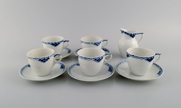 Royal Copenhagen blue painted Princess. Set of five coffee cups with saucers along with creamer in porcelain. Model Number 756.