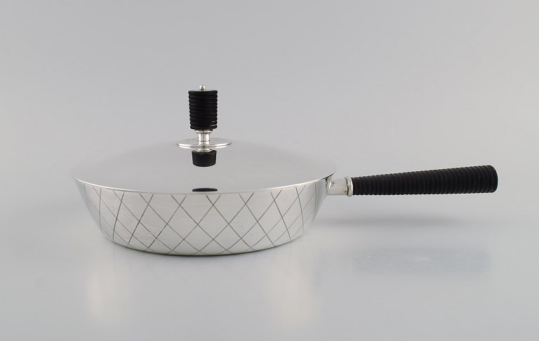 Sigvard Bernadotte for Georg Jensen. Rare casserole in sterling silver with handle and lid knob in ebony. Model number 909C.