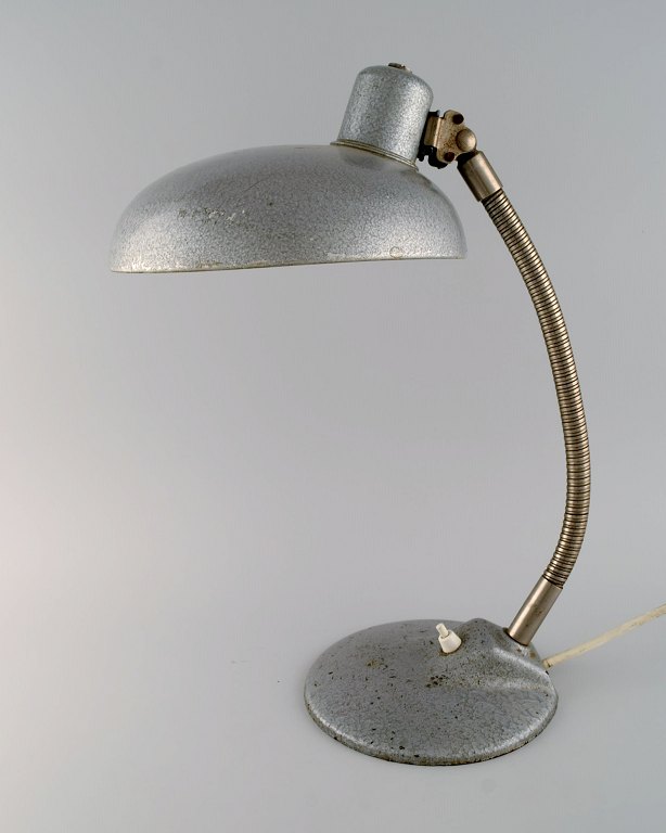 Adjustable desk lamp in original metallic lacquer. Industrial design, mid 20th century.