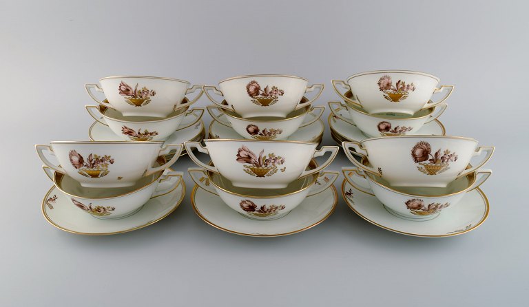 Twelve Royal Copenhagen Golden Basket bouillon cups with saucers.Model number 595/9571. Dated 1889-1922.