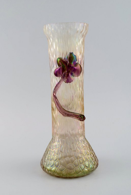 Lötz art nouveau vase in frosted mouth-blown art glass with purple flowers in relief. Approx. 1900.