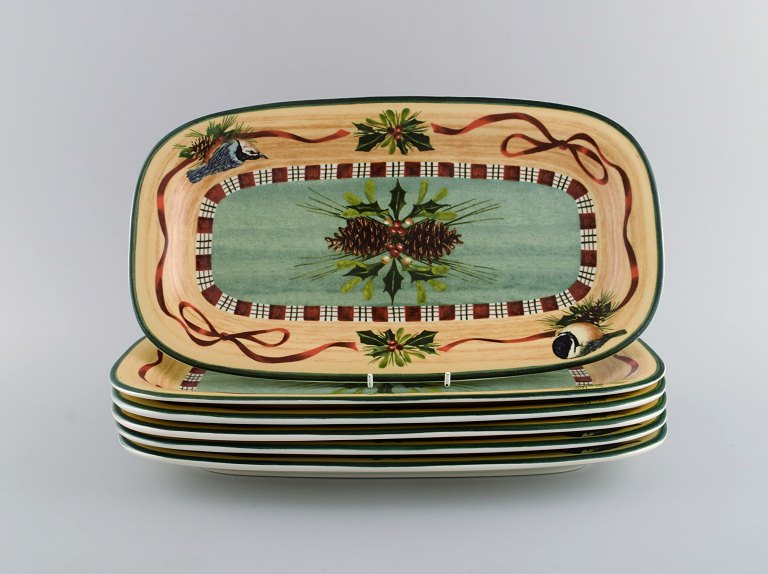 Catherine McClung for Lenox. "Winter greetings". Six oblong dishes in glazed stoneware decorated with mistletoe, pine cones and birds. Approx. 2000.