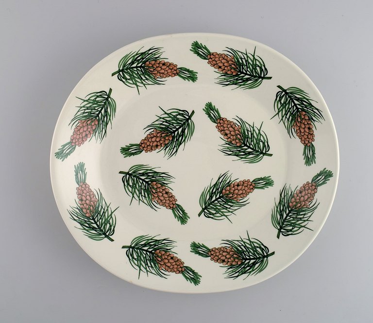 Oval Arabia dish in glazed stoneware with hand-painted fir cones. Finnish design. Dated 1972.