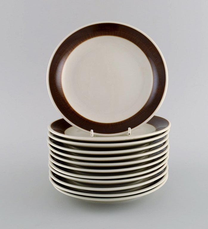 Hertha Bengtson (1917-1993) for Rörstrand. Twelve Koka cake plates in glazed stoneware. 1960s.