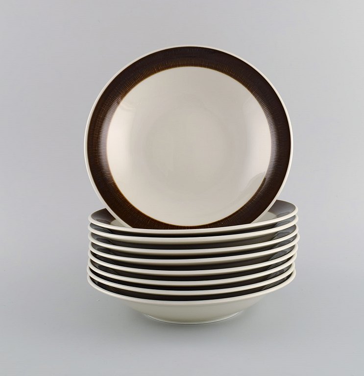 Hertha Bengtson (1917-1993) for Rörstrand. Nine Koka deep plates in glazed stoneware. 1960s.