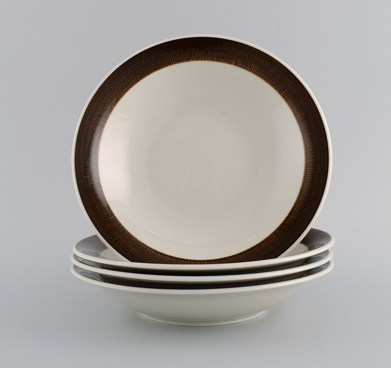 Hertha Bengtson (1917-1993) for Rörstrand. Four Koka deep plates in glazed stoneware. 1960s.
