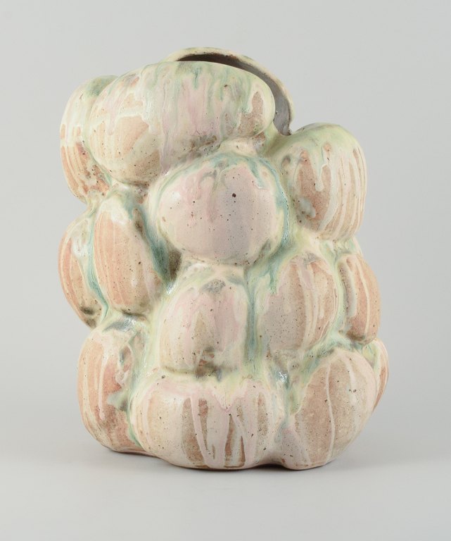 Christina Muff, dansk samtidskeramiker (f. 1971).Monumental organically shaped sculpture. This piece is covered in multicolored pastel glaze, the clay showing between glaze runs.
