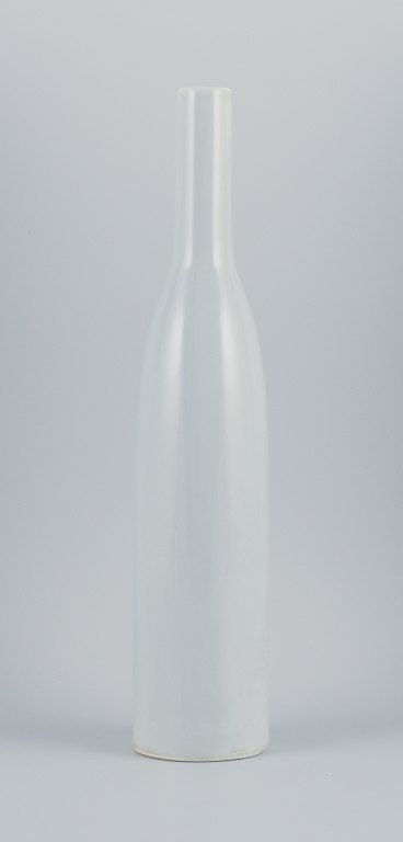 Style of Ruelland, tall bottle-shaped ceramic vase.Light gray glaze. Handmade.