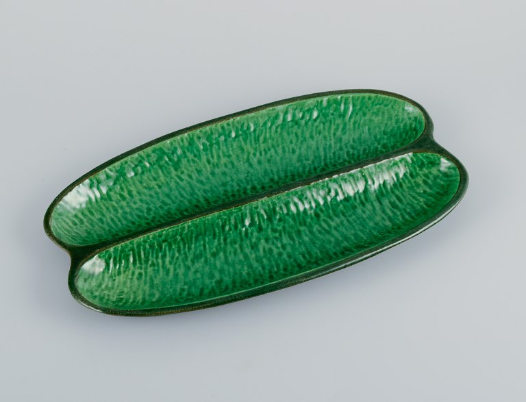 Höganäs, elongated two-part ceramic dish in an organic shape.Beautiful glaze in shades of green.