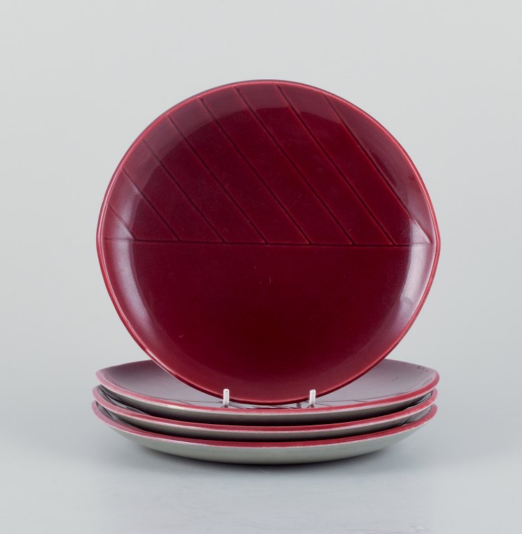 Carl Harry Stålhane for Rörstrand, Sweden, a set of four "California" ceramic plates, violet glaze. Stylish design.