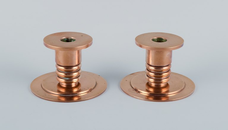Evan Jensen, bronze caster in Copenhagen, Denmark, a pair of Art Deco bronze candleholders.
