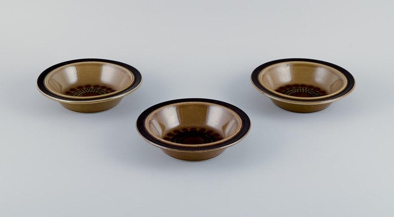 Gunvor Olin-Grönqvist for Arabia, "Cosmos," three deep plates. Stoneware in a retro style. Glazed in green-brown tones.