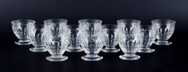 Baccarat, France, a set of twelve "Charmes" Art Deco water glasses in clear crystal glass. Faceted cut.