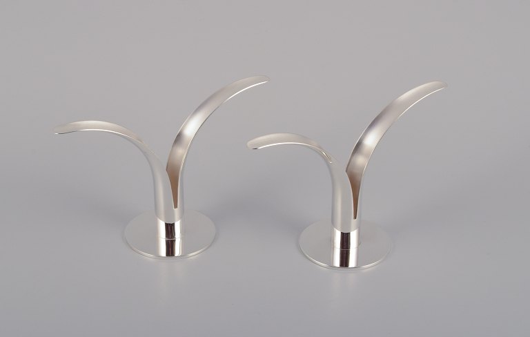 Ivar Ålenius Björk (1905-1978), Ystad Metall.A pair of "Liljan" (Lilly) candle holders in plated silver. Swedish design classic