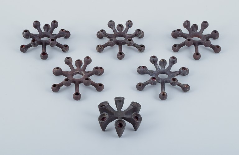 Jens Harald Quistgaard for Dansk Designs, a set of six candle holders in cast iron.