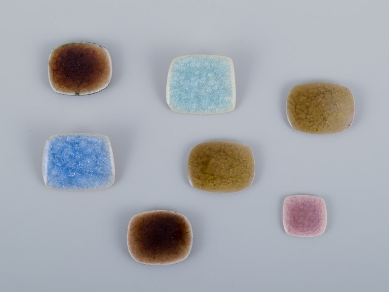 Ole Bjørn Krüger (1922-2007), Danish sculptor and ceramic artist. Seven unique brooches in glazed stoneware in blue and various colors.