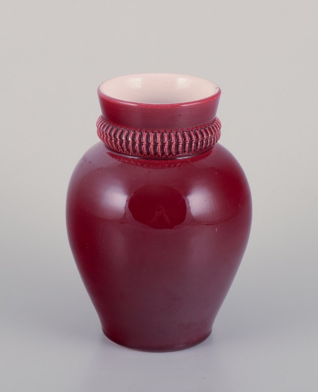 Pol Chambost (1906-1983), French ceramist.Hand-decorated ceramic vase with burgundy-toned glaze.